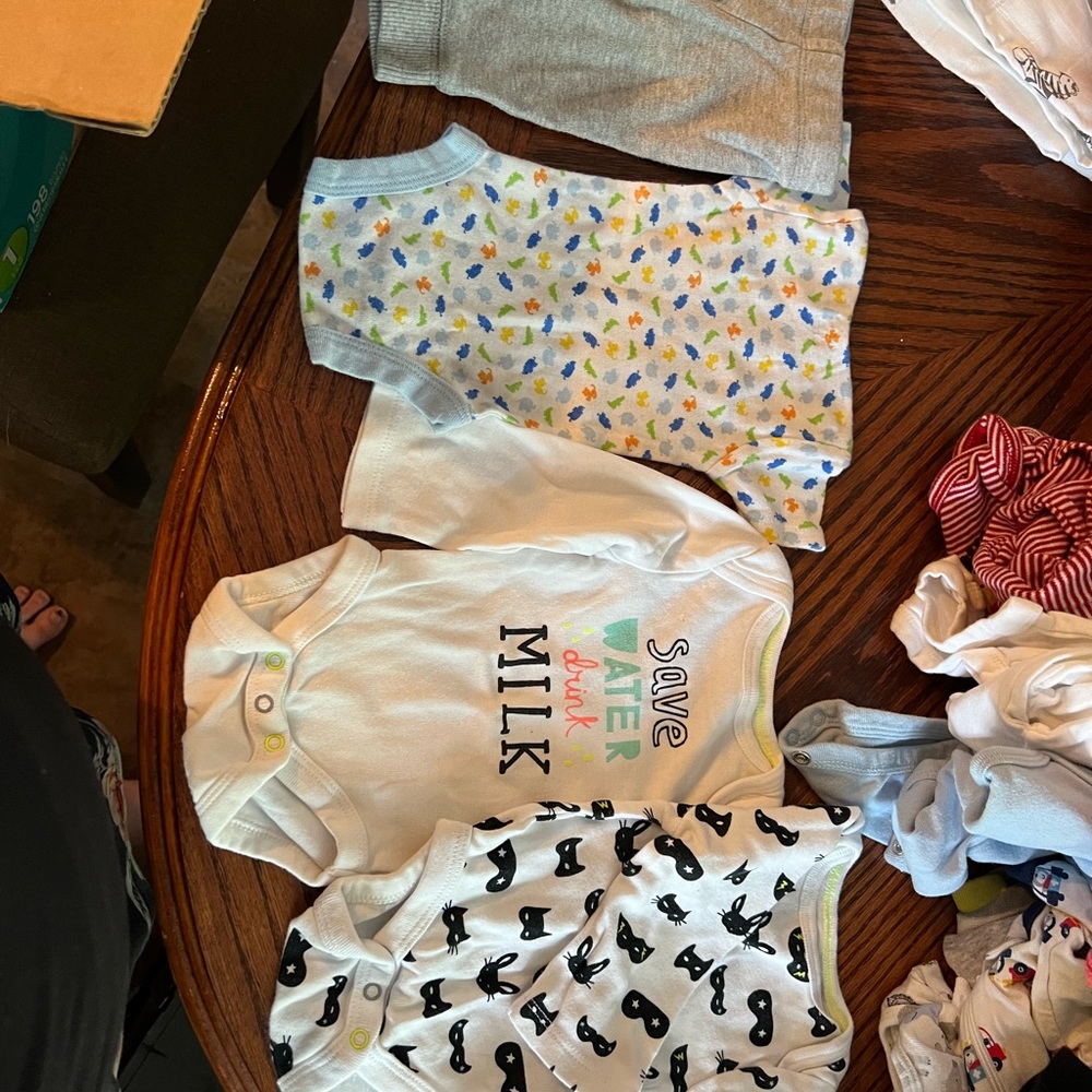 Newborn baby clothes. Some neutral, some boys. Over 50 pieces total.